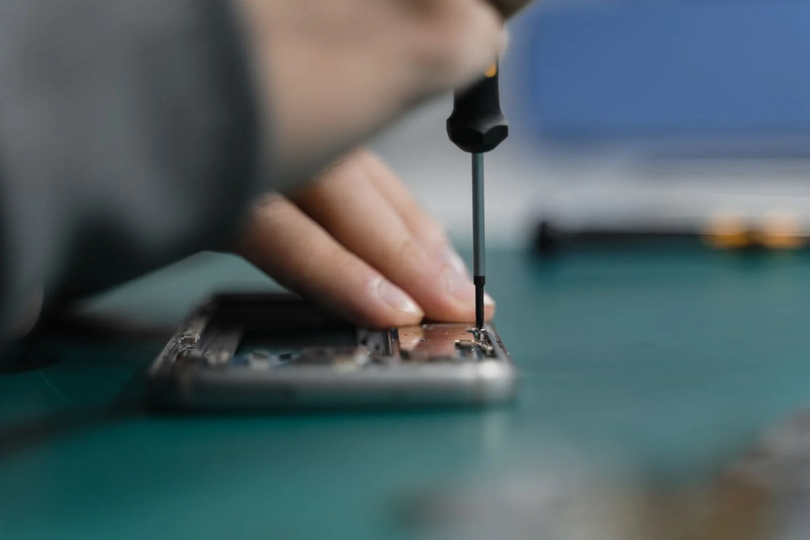 Illustrative precision-tool smartphone repair photograph