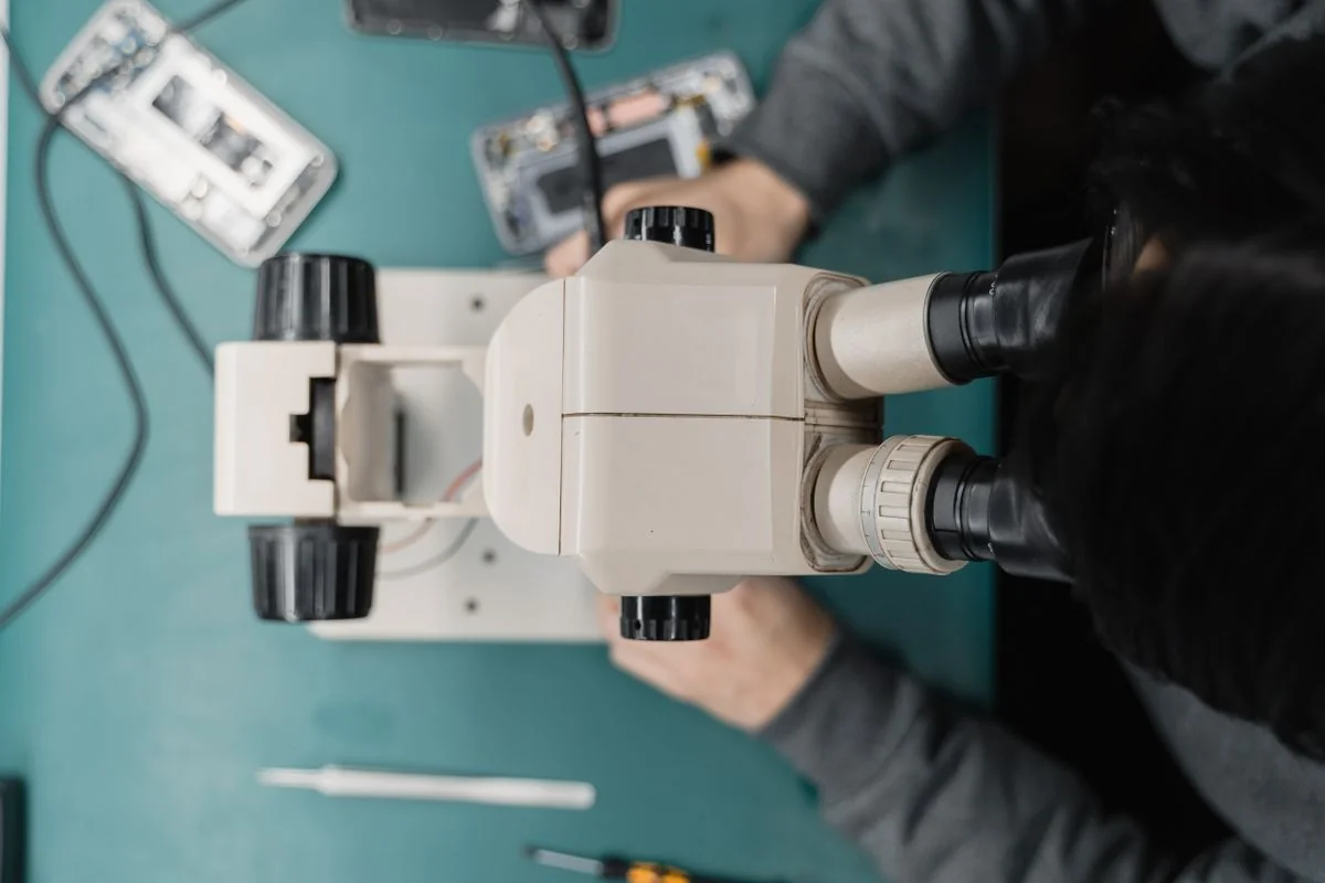 Illustrative smartphone inspection under a microscope